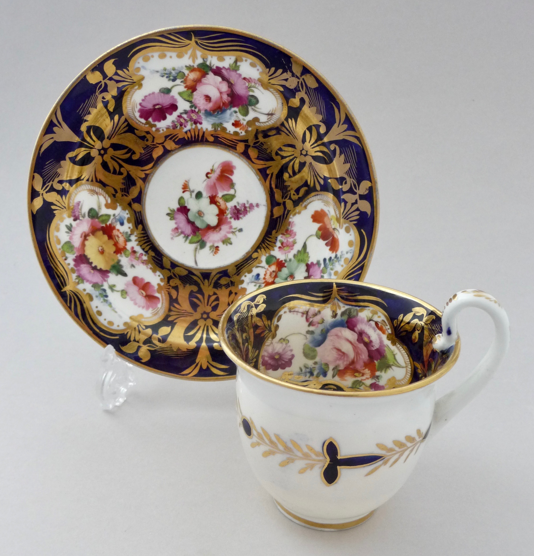 Coalport 'Etruscan' richly decorated cup and saucer, c.1820